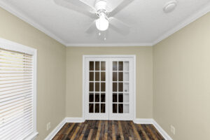 Spare bedroom connected to another bedroom by french doors