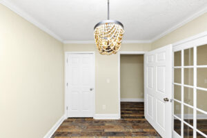 Spare bedroom connected to another bedroom by french doors
