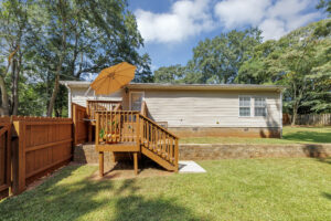 Fenced in yard and back deck