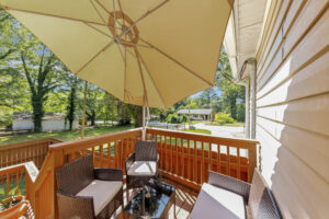 Back deck with umbrella open on a sunny day